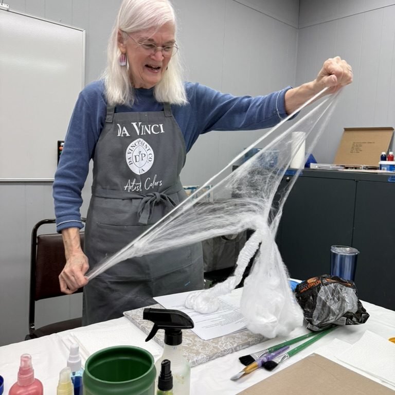 Susan demonstrates pulling the "webs" for texture.